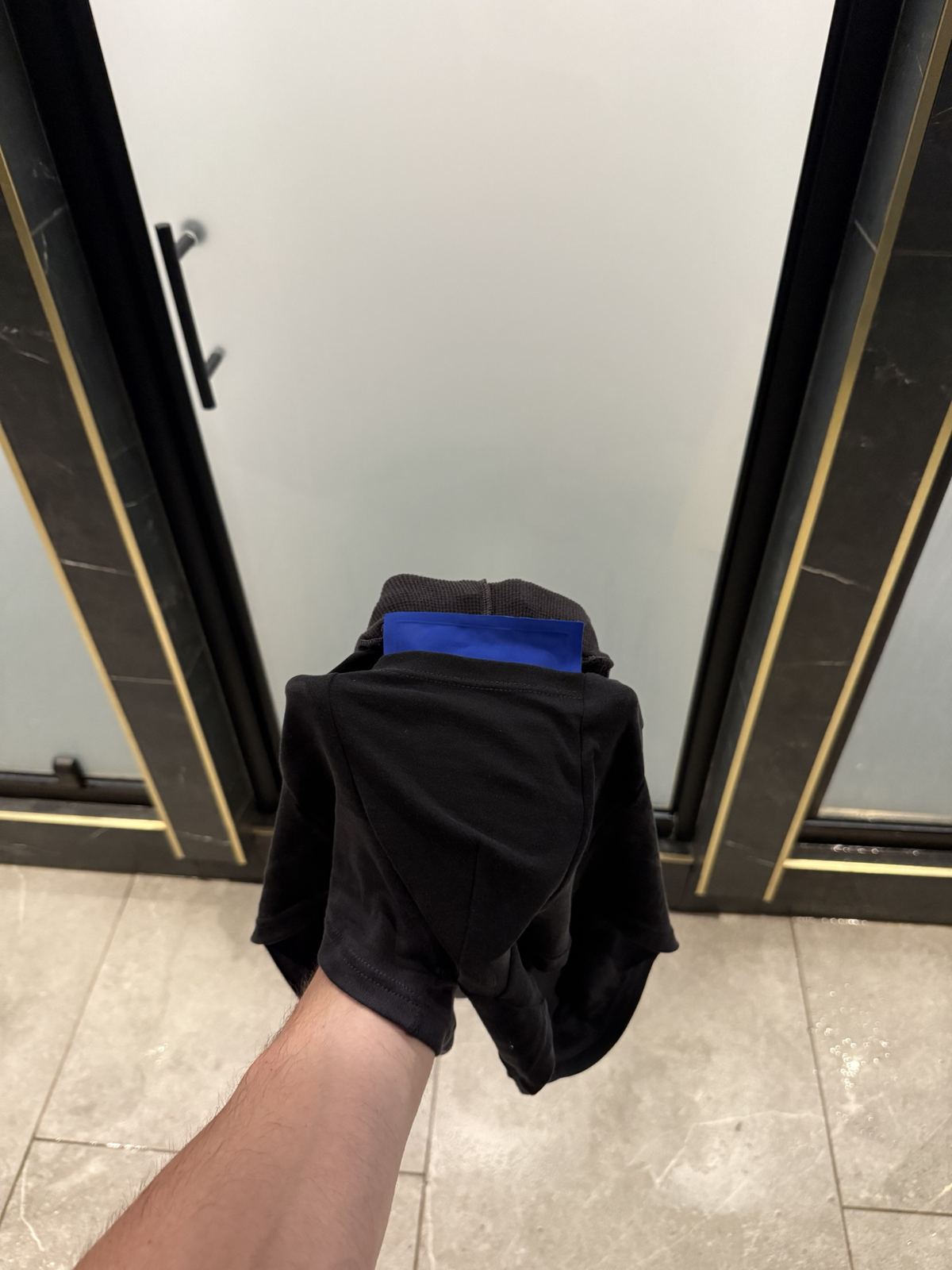 The Amuro short turned inside out, showing the black liner and a blue gel pack sitting in the pouch.
